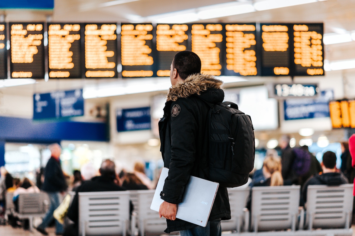 Traveller in Airport - Travel Scams to Avoid